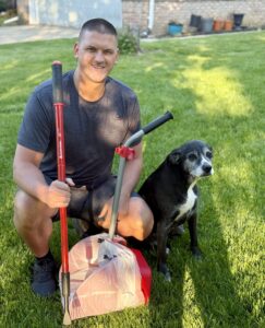 Ohio Pet Waste Pros owner with scooping equipment and customer's dog in Toledo