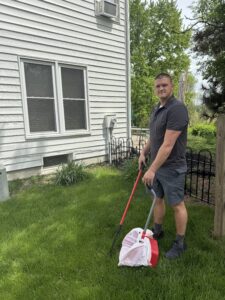 Ohio Pet Waste Pros owner cleaning dog poop from a yard