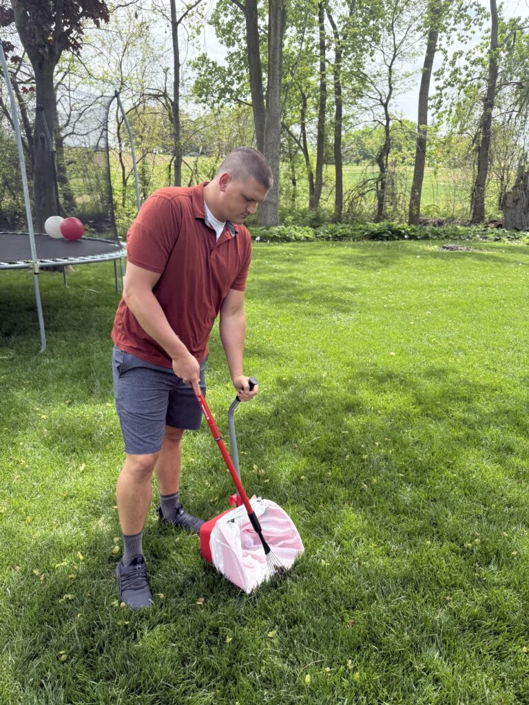 technician cleaning down poop in a yard in Swanton, OH