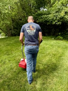 Ohio Pet Waste Pros technician wearing our branded shirt uniform