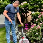 Ohio Pet Waste Pros technician scooping yard in Sylvania