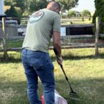 Ohio Pet Waste Pros owner, Craig, cleaning dog waste from a yard in Maumee which is in the Anthony Wayne district