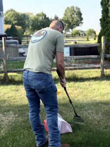 Ohio Pet Waste Pros owner, Craig, cleaning dog waste from a yard in Anthony Wayne district