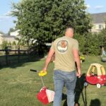 Pooper scooper technician cleaning pet waste from a yard to make it clean and safe for kids