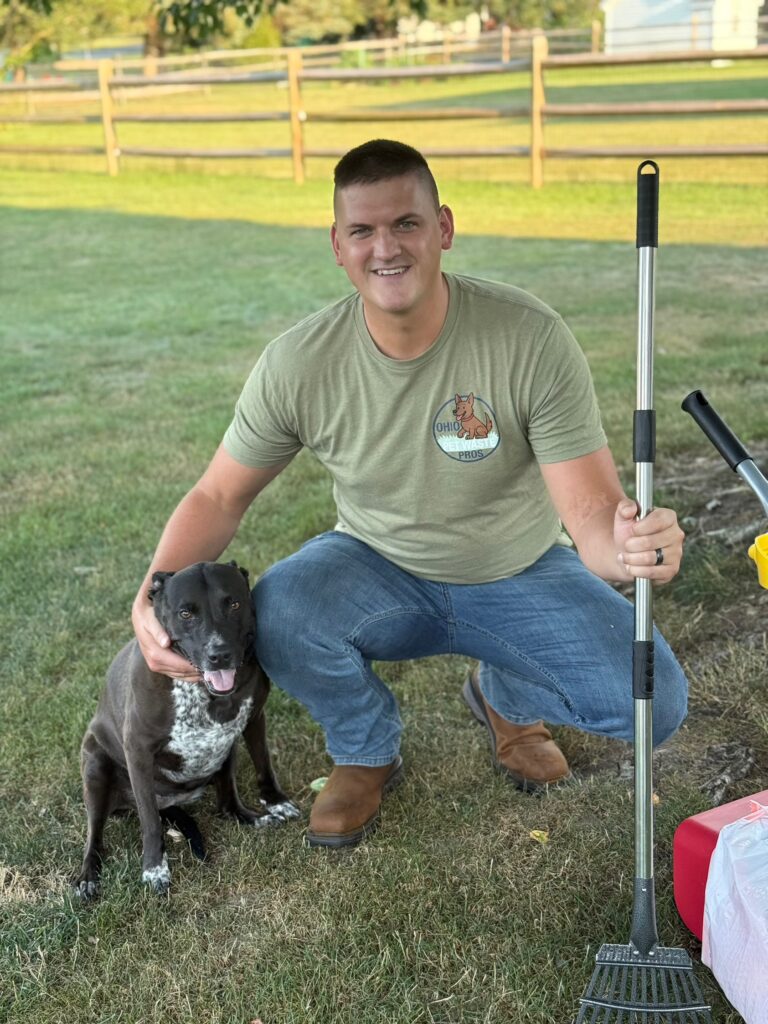 Ohio Pet Waste Pros dog poop cleanup tech and owner with a client's dog in their Maumee yard